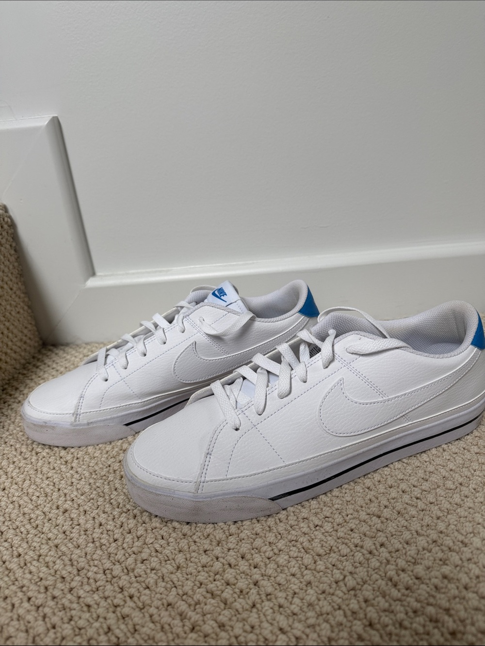 Nike White Low-Top Sneakers with Blue Heel Tab